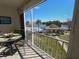 Balcony view overlooking a pool, lake, and community at 3935 Lake Bayshore Dr # F-316, Bradenton, FL 34205