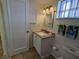 Bathroom with single sink vanity and toilet at 3935 Lake Bayshore Dr # F-316, Bradenton, FL 34205