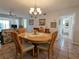 Dining area with wood table and chairs, near living room at 3935 Lake Bayshore Dr # F-316, Bradenton, FL 34205