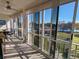 Spacious lanai with water views and seating at 3935 Lake Bayshore Dr # F-316, Bradenton, FL 34205