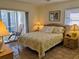 Bedroom with sliding doors to balcony at 3935 Lake Bayshore Dr # F-316, Bradenton, FL 34205
