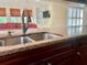 Kitchen boasts granite countertops and a double sink at 4174 Oakhurst W Cir # 3159, Sarasota, FL 34233