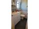 Small bathroom with toilet and a vanity with storage at 4924 Live Oak Cir # 115, Bradenton, FL 34207