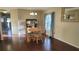 Dining room features hardwood floors and a round table at 4924 Live Oak Cir # 115, Bradenton, FL 34207