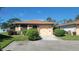 Brick ranch home with attached garage and landscaped yard at 4924 Live Oak Cir # 115, Bradenton, FL 34207