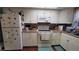 Kitchen with white cabinets, tile backsplash, and modern appliances at 4924 Live Oak Cir # 115, Bradenton, FL 34207