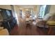 Living room with hardwood floors, comfortable seating, and a TV at 4924 Live Oak Cir # 115, Bradenton, FL 34207