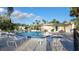 Inviting community pool with ample seating and a nearby building at 4924 Live Oak Cir # 115, Bradenton, FL 34207