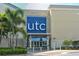 Exterior view of UTC mall featuring palm trees and modern architecture at 5663 Country Lakes Dr, Sarasota, FL 34243