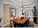 Formal dining room featuring a wood table and ornate mirror at 5717 Cheech Gln, Bradenton, FL 34211