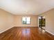 Bedroom with hardwood floors and access to patio at 5915 Wilshire Blvd # 126, Sarasota, FL 34238