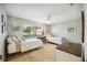 Two twin beds in a well-lit bedroom with window and ceiling fan at 6515 Heritage Ln # 2615, Bradenton, FL 34209
