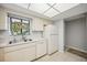 Kitchen with white cabinets, stainless steel appliances, and tile floors at 6515 Heritage Ln # 2615, Bradenton, FL 34209