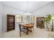 Bright dining room with wood table, chairs, and built-in hutch at 6515 Heritage Ln # 2615, Bradenton, FL 34209