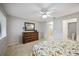 Bedroom with a dresser, a queen bed, and en-suite access at 6515 Heritage Ln # 2615, Bradenton, FL 34209