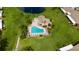 Community pool, spa, and clubhouse near a pond at 6515 Heritage Ln # 2615, Bradenton, FL 34209