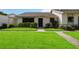 Front view of a condo with well-maintained lawn at 6515 Heritage Ln # 2615, Bradenton, FL 34209