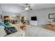 Living room with off-white couch and access to dining area at 6515 Heritage Ln # 2615, Bradenton, FL 34209