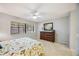 Bedroom with a dresser, a queen bed, and a window at 6515 Heritage Ln # 2615, Bradenton, FL 34209