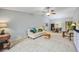 Living room with off-white couch and access to dining area at 6515 Heritage Ln # 2615, Bradenton, FL 34209