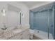Modern bathroom with a walk-in shower and granite countertop at 6515 Heritage Ln # 2615, Bradenton, FL 34209