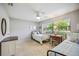 Bright bedroom with two twin beds, a dresser, and window at 6515 Heritage Ln # 2615, Bradenton, FL 34209