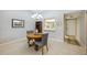 Charming dining area with round table and gray chairs near kitchen at 6515 Heritage Ln # 2615, Bradenton, FL 34209