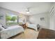 Two twin beds in a well-lit bedroom with window and ceiling fan at 6515 Heritage Ln # 2615, Bradenton, FL 34209