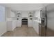 Modern kitchen with white cabinets and stainless steel appliances at 6515 Heritage Ln # 2615, Bradenton, FL 34209