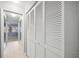 Hallway with built-in storage and view of another room at 6515 Heritage Ln # 2615, Bradenton, FL 34209