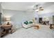 Living room with off-white couch and access to dining area at 6515 Heritage Ln # 2615, Bradenton, FL 34209