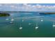 Aerial view of waterfront homes and sailboats at 6901 Poinsettia Ave, Longboat Key, FL 34228