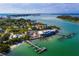 Aerial view of waterfront community with boat docks and lush landscaping at 6901 Poinsettia Ave, Longboat Key, FL 34228