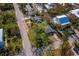 Home nestled amongst lush landscaping, near the road at 6901 Poinsettia Ave, Longboat Key, FL 34228