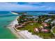 Aerial view showing coastal community near beach with pool and lush grounds at 6901 Poinsettia Ave, Longboat Key, FL 34228