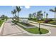 Entrance to the Esplanade community, featuring landscaping and signage at 10128 Morning Mist Ln, Sarasota, FL 34241