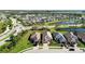 Aerial view of a community with houses, roads, and ponds at 10128 Morning Mist Ln, Sarasota, FL 34241