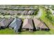 Aerial view of the back of several homes with tile roofs at 10128 Morning Mist Ln, Sarasota, FL 34241