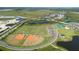 Aerial view of community amenities including sports fields at 10128 Morning Mist Ln, Sarasota, FL 34241