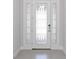 Bright entryway with white door and glass accents at 10128 Morning Mist Ln, Sarasota, FL 34241