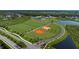 Aerial view of community amenities including sports fields and lakes at 10128 Morning Mist Ln, Sarasota, FL 34241