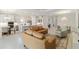 Open floor plan of the living, dining, and kitchen areas has neutral walls and flooring with ample recessed lighting at 10128 Morning Mist Ln, Sarasota, FL 34241