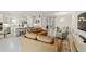 Open concept floorplan features a living room that flows into a kitchen, dining room, and view to the entry hall at 10128 Morning Mist Ln, Sarasota, FL 34241