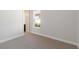 Bright bedroom with large window and access to bathroom at 10128 Morning Mist Ln, Sarasota, FL 34241