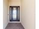 Elegant entryway with a dark-stained door and glass inserts at 10128 Morning Mist Ln, Sarasota, FL 34241