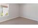 Bright bedroom with large window and neutral walls at 10128 Morning Mist Ln, Sarasota, FL 34241