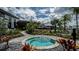 Circular spa surrounded by lush landscaping at 10128 Morning Mist Ln, Sarasota, FL 34241