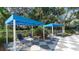 Two shaded cabanas with lounge chairs for relaxing by the pool at 12797 Palatka Dr, Venice, FL 34293