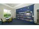 Community library with a wall of bookshelves and seating area at 12797 Palatka Dr, Venice, FL 34293