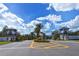 Grand entrance to the Grand Palm community with lush landscaping at 12797 Palatka Dr, Venice, FL 34293